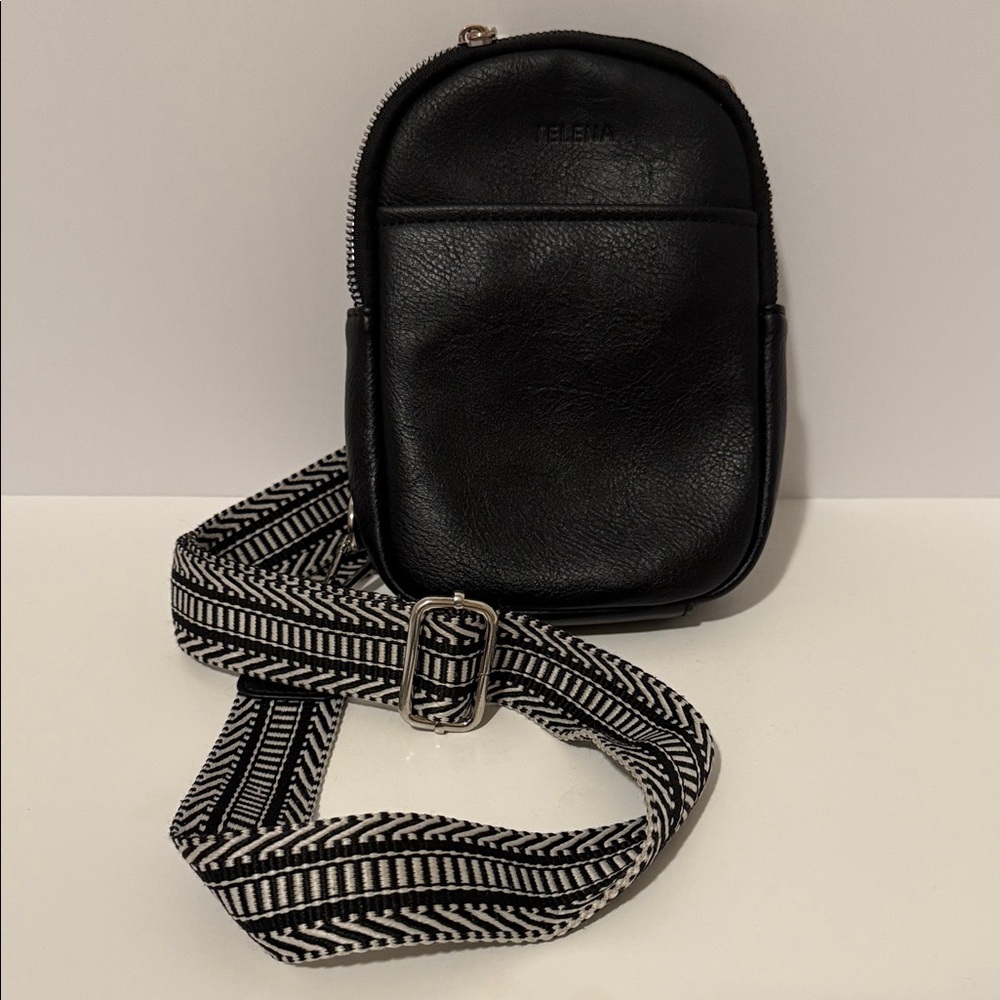 Telena leather Crossbody‎ sling bag w/ adjustable black and white strap.